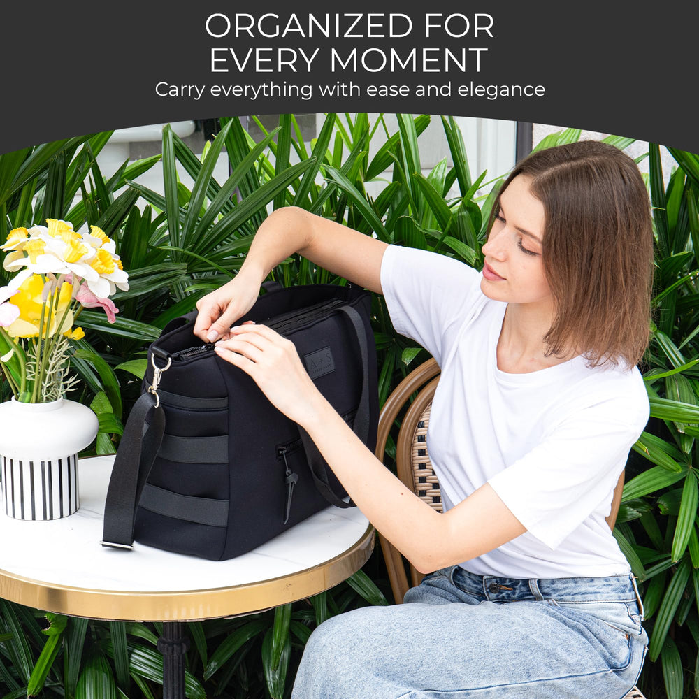 A + S Luxxe Diaper Bag Tote's waterproof lining protects contents during spills.