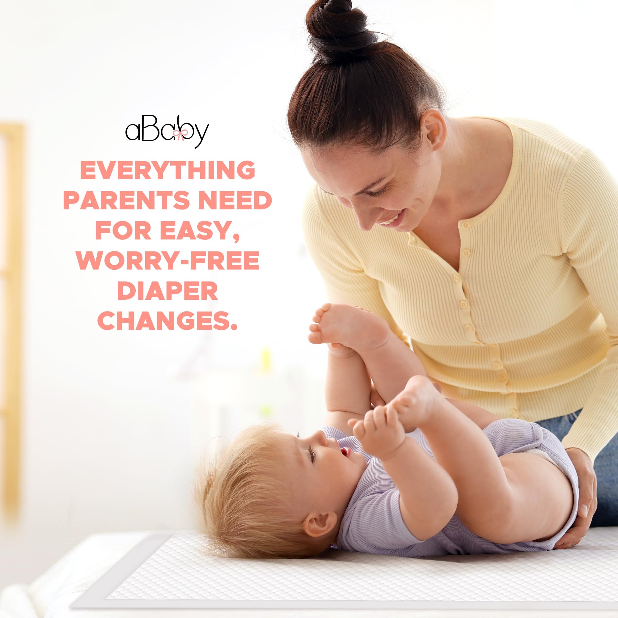 ABABY REFRESH disposable changing pads in use on table for quick, hygienic diaper changes.