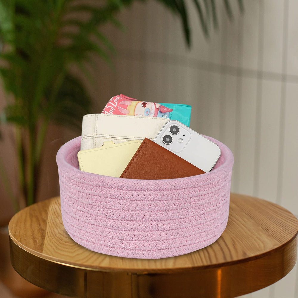 ABenkle pink basket on nightstand for keys and small essentials