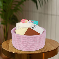 ABenkle pink basket on nightstand for keys and small essentials