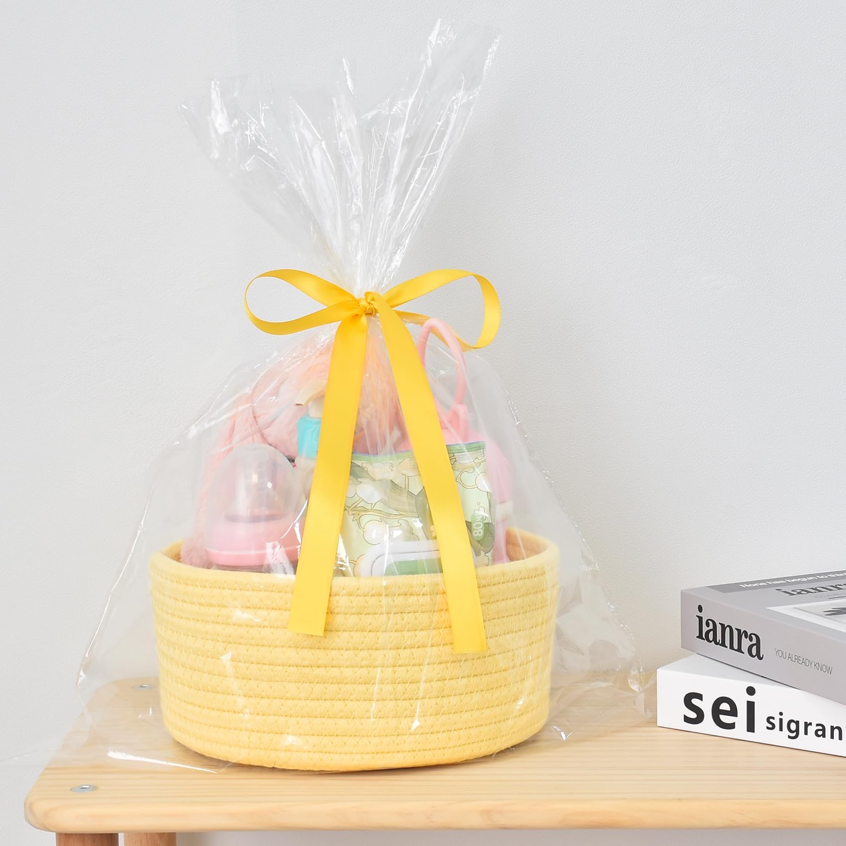 ABenkle bathroom-counter basket simplifies keeping cosmetics and towels tidy.