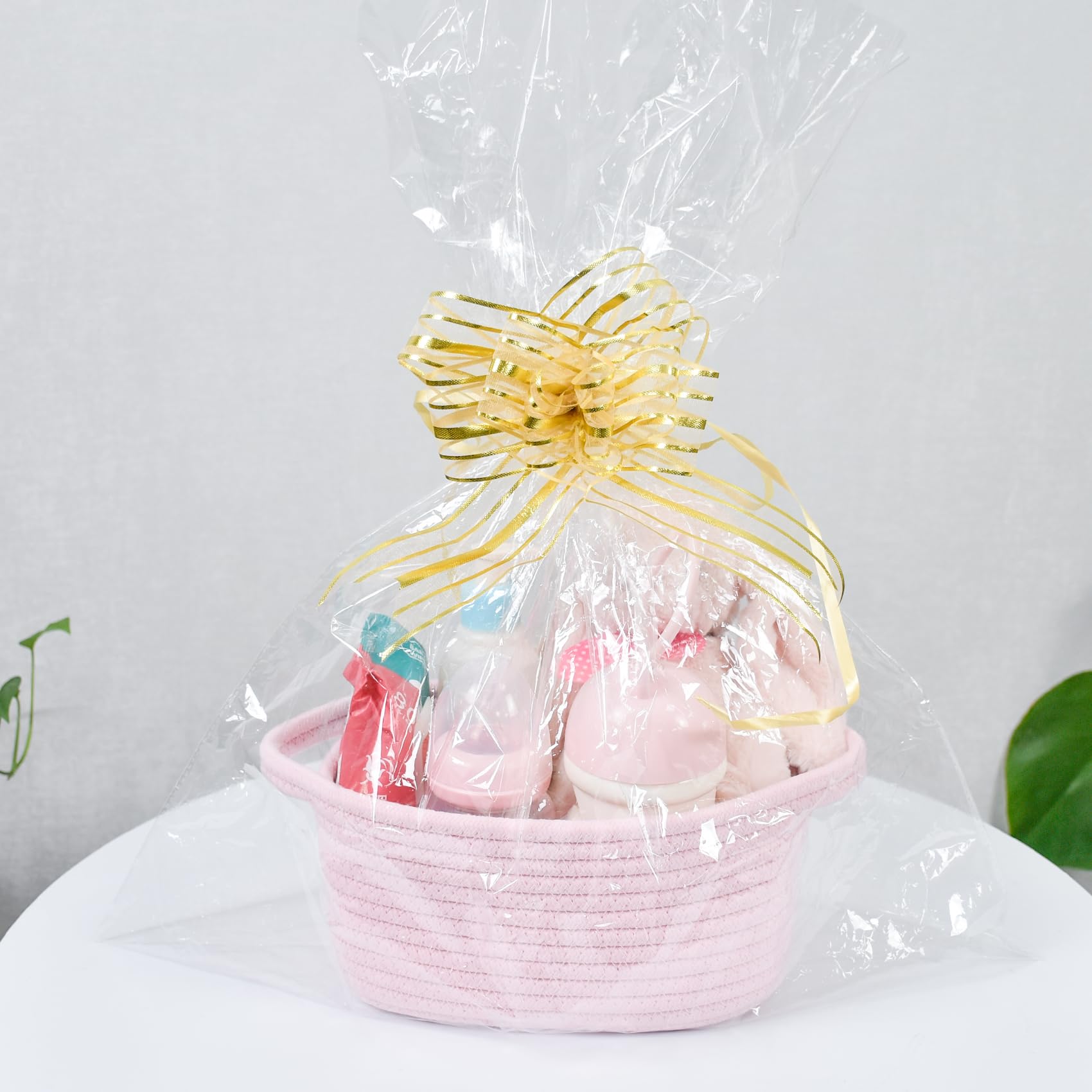 ABenkle storage basket in bedroom for toy or towel organization.