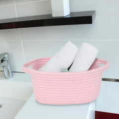 ABenkle cotton rope basket with handles offers easy, decorative organization.
