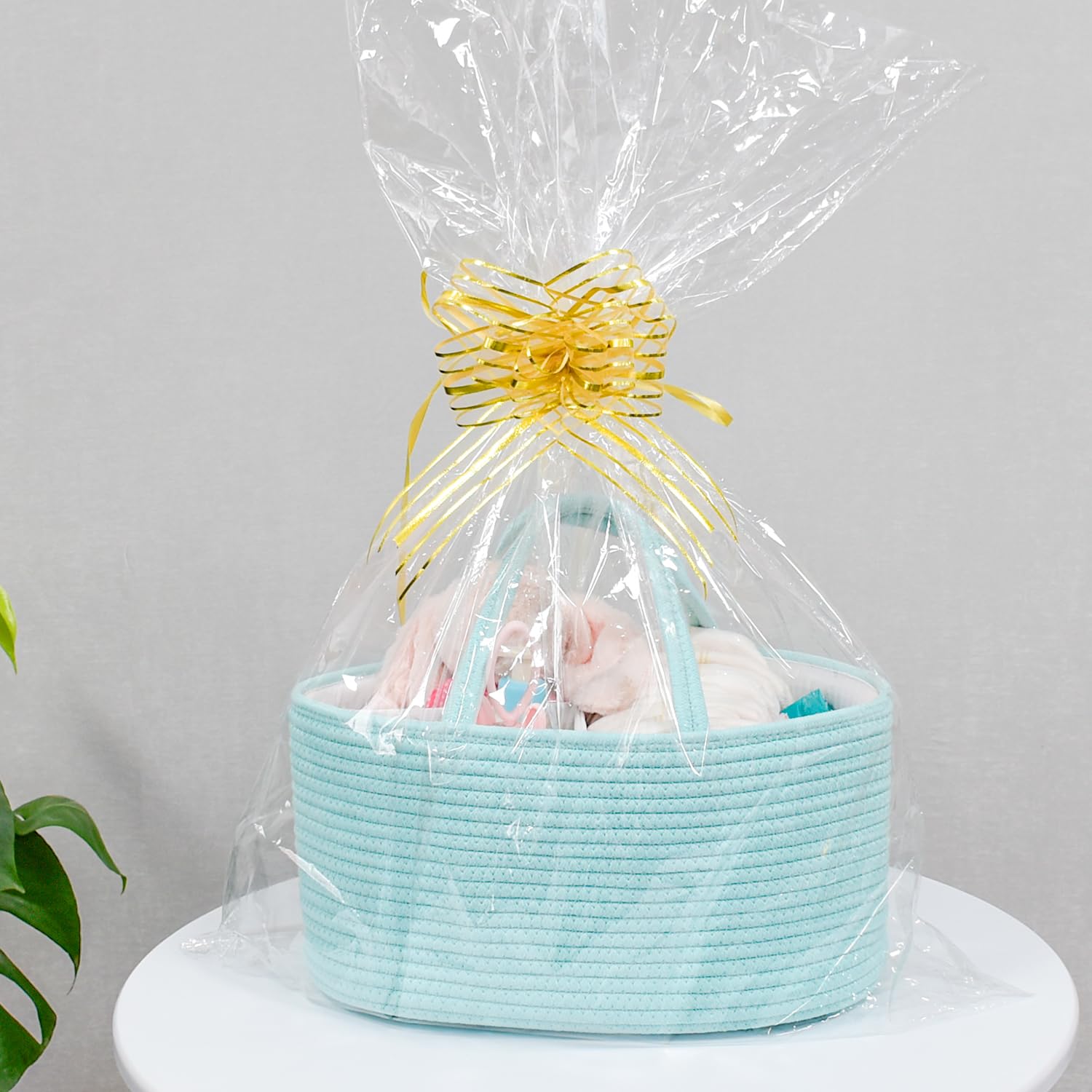 ABenkle diaper caddy on changing table with diapers and wipes within reach