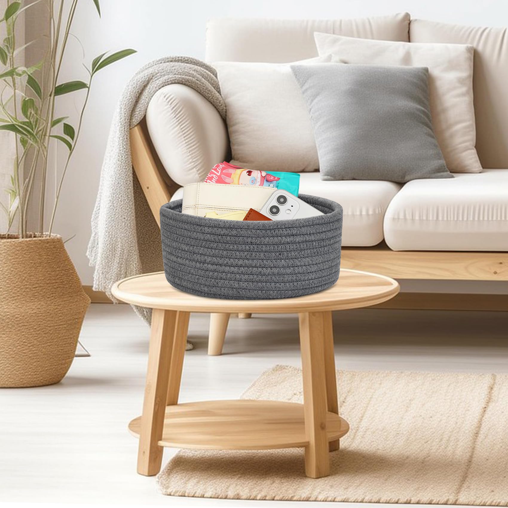 ABenkle nursery side table basket adds soft storage for baby essentials.
