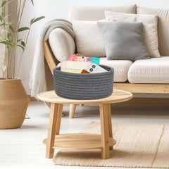 ABenkle nursery side table basket adds soft storage for baby essentials.
