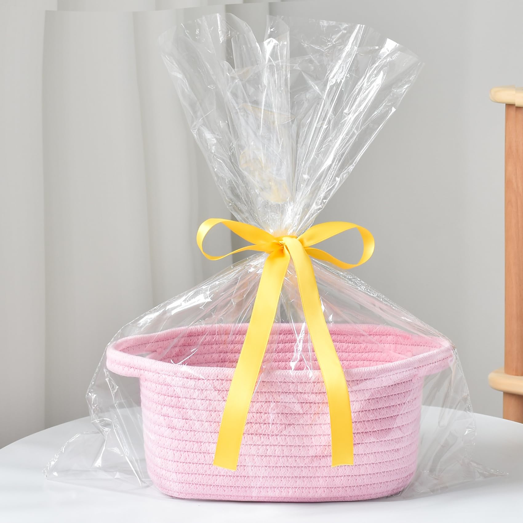 ABenkle basket with handles complements shelves and preserves surface tidiness
