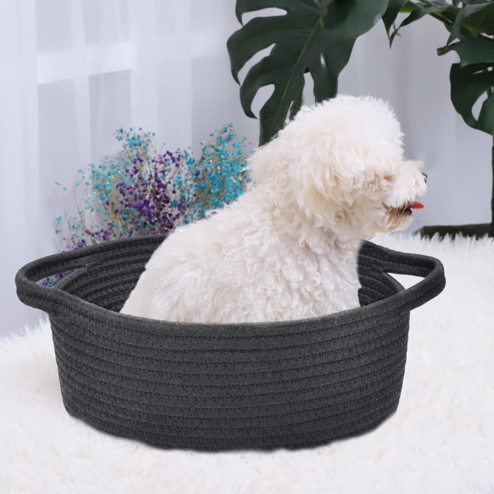 ABenkle small basket with handles on shelf demonstrates tidy toy and towel organization