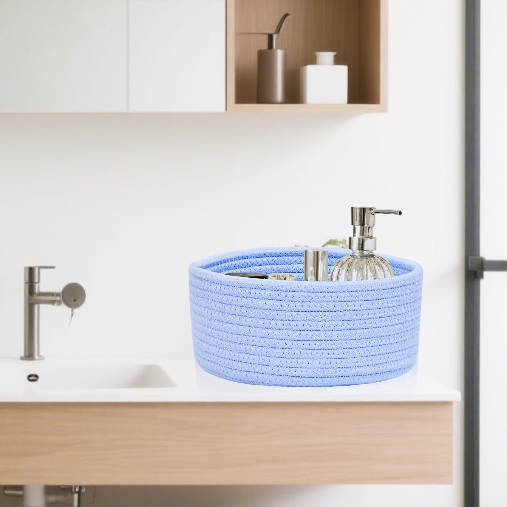 ABenkle small round basket ideal for nursery items like diapers and wipes.
