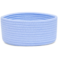 ABenkle small round basket holds pencils and small desk essentials for a neater workspace.