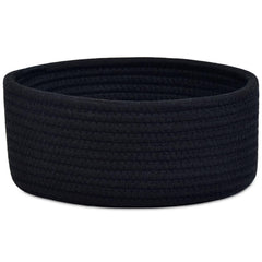 ABenkle small round basket on shelf for compact storage of keys and cosmetics.