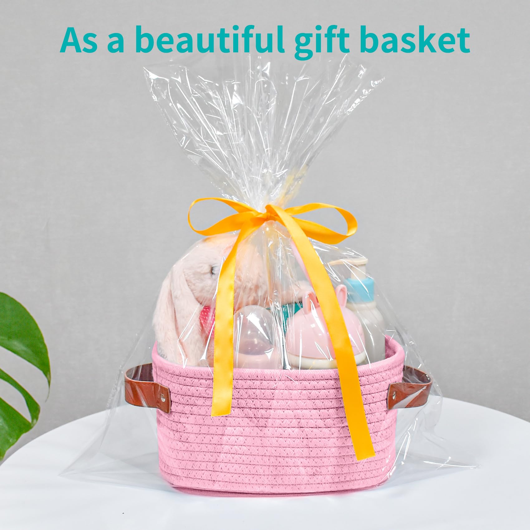 ABenkle pink storage basket in use on desk with supplies.