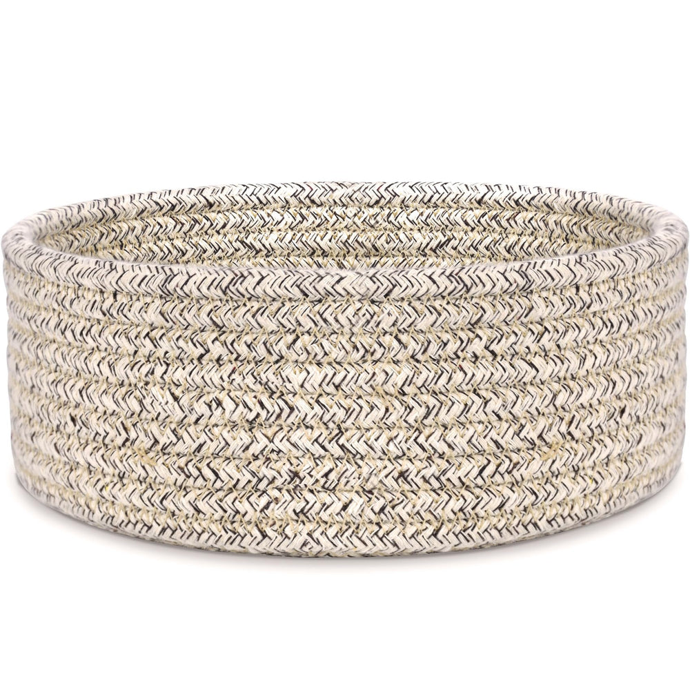 ABenkle small woven basket on a desk keeps keys, remotes, and small items organized.