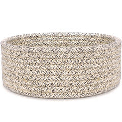 ABenkle small woven basket on a desk keeps keys, remotes, and small items organized.