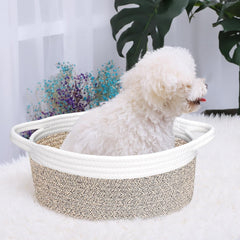 ABenkle small woven basket with baby items and towels in nursery