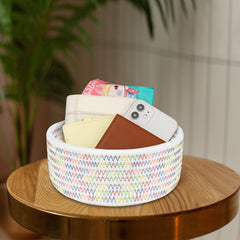 ABenkle small woven basket on nursery shelf for toys and essentials.
