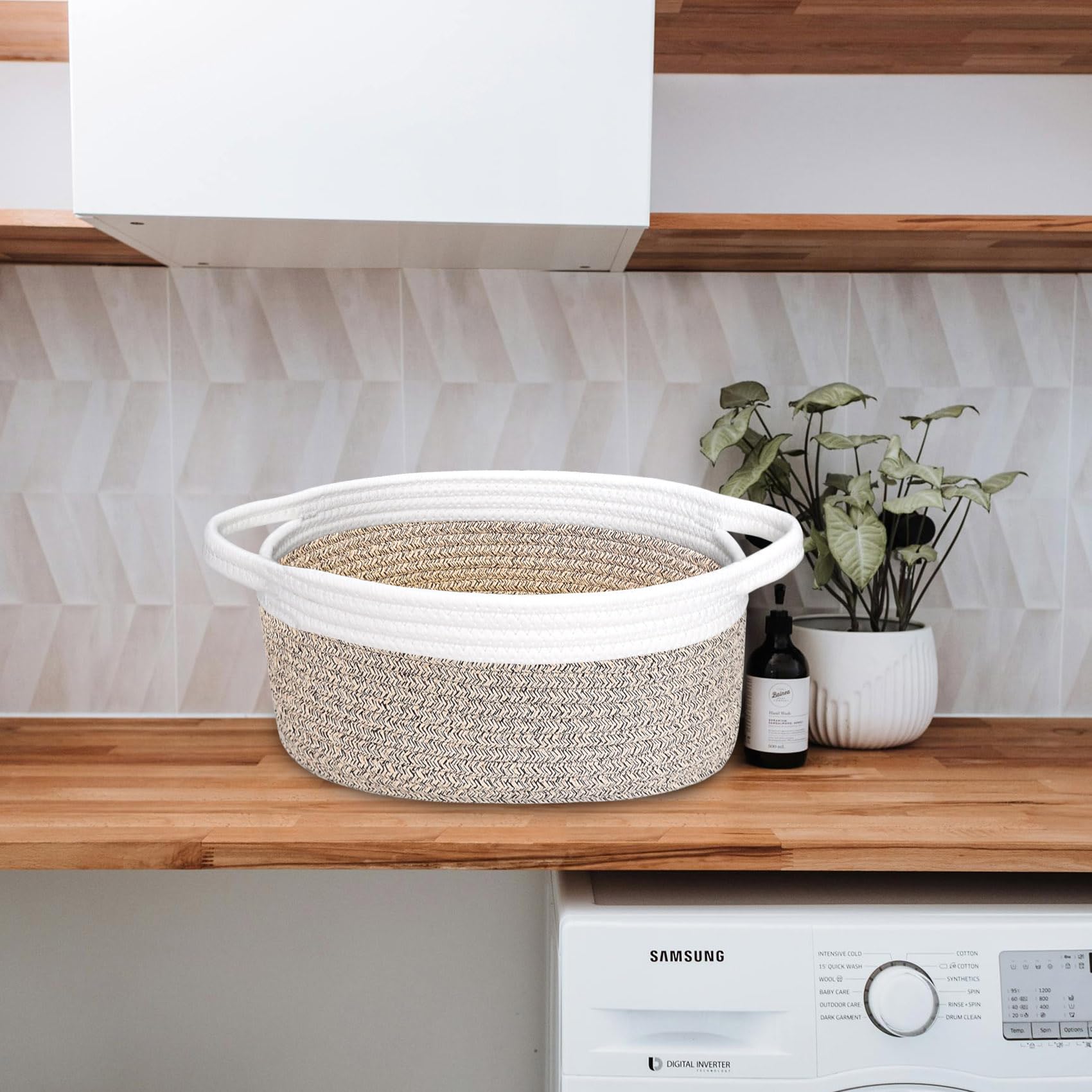ABenkle small woven basket used for pet toy storage on living room shelf