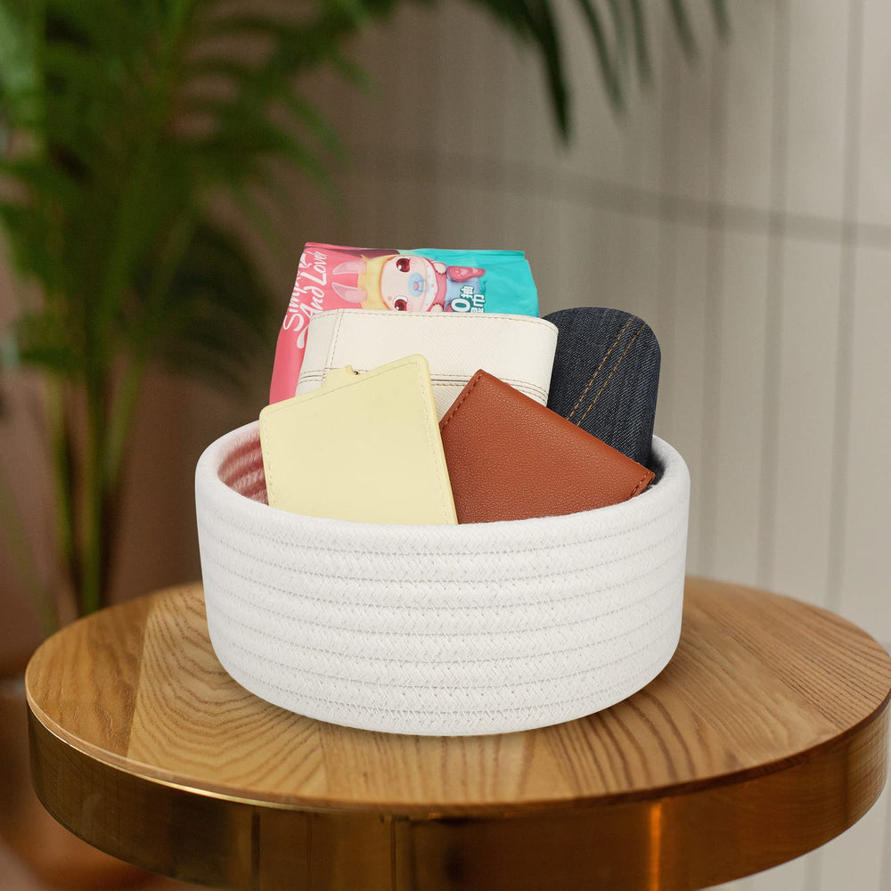 ABenkle white basket side close-up, soft cotton rope texture adds cozy decor.