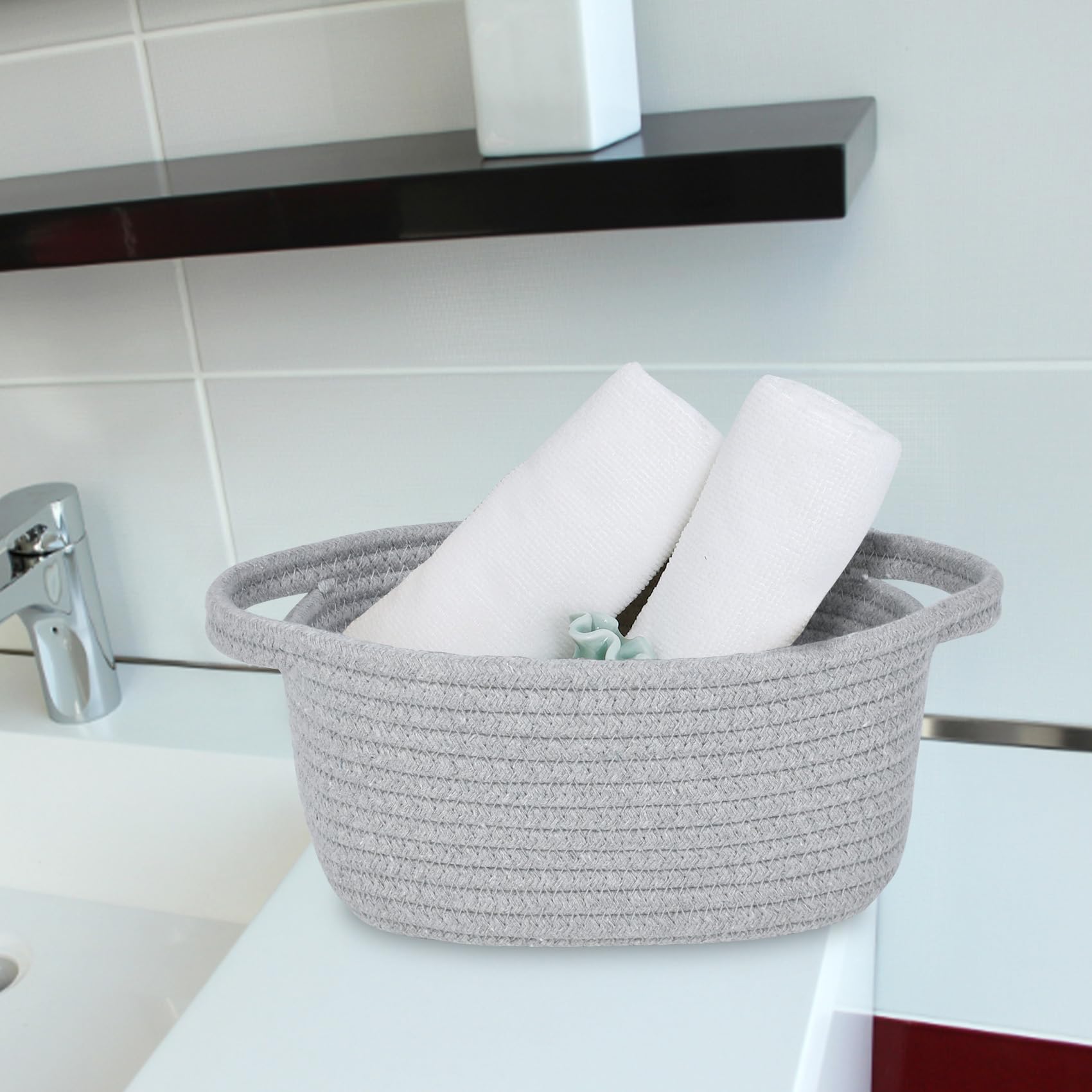ABenkle storage basket on a bedside table shows easy grab-and-go bathroom storage.