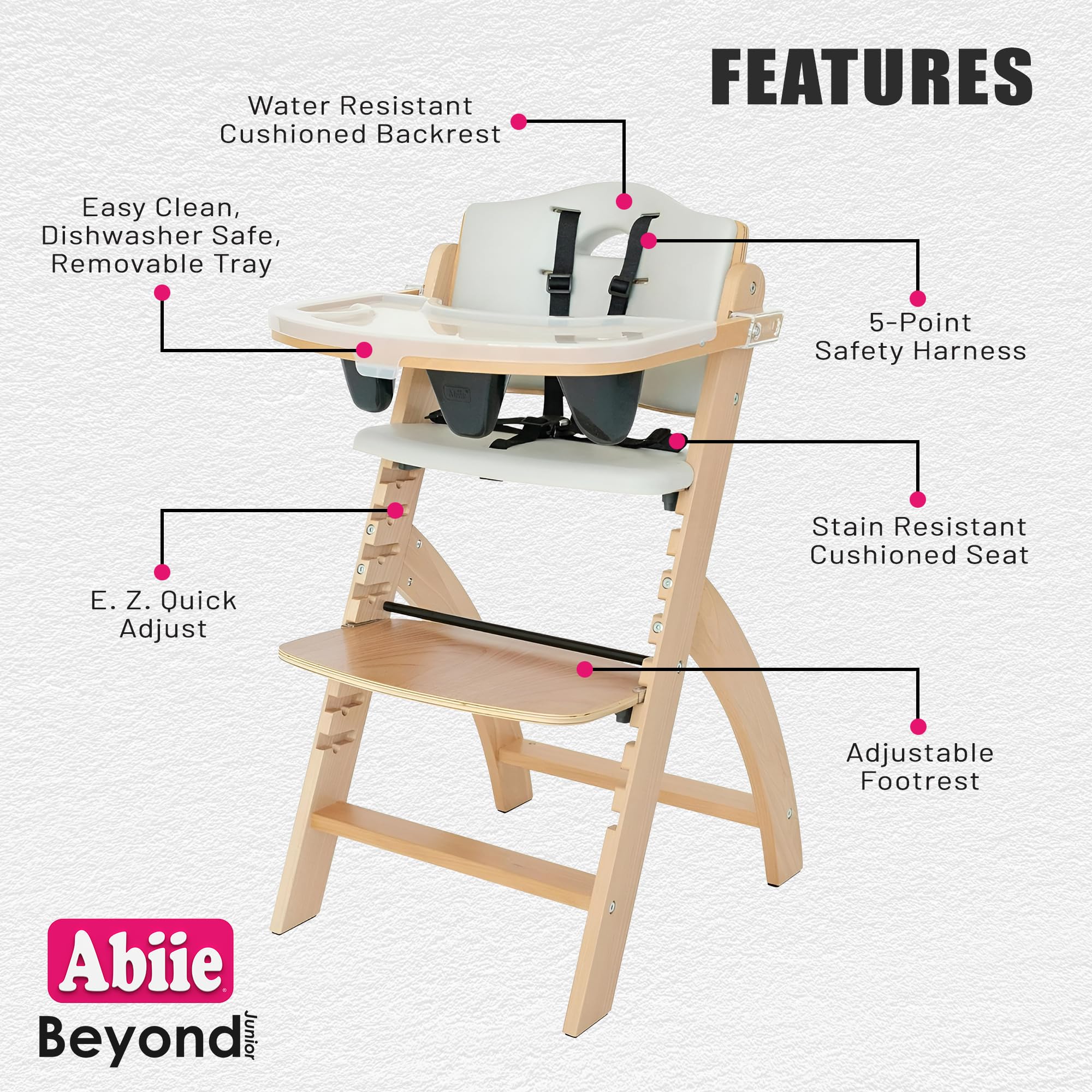 Abiie Beyond Junior wood high chair in adjustable height mode for growing children.