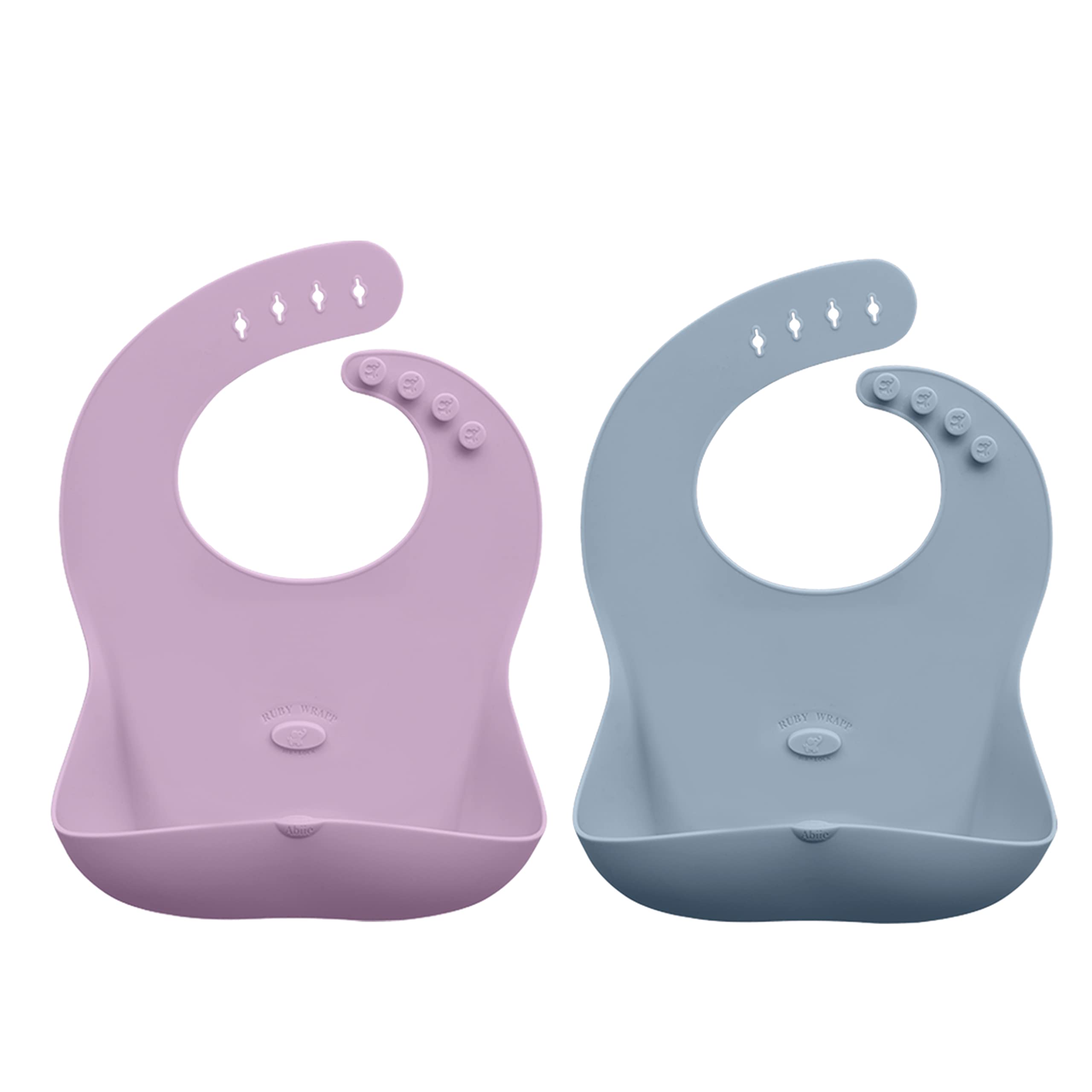 Abiie Ruby Wrapp bib rolled for compact storage on the go.