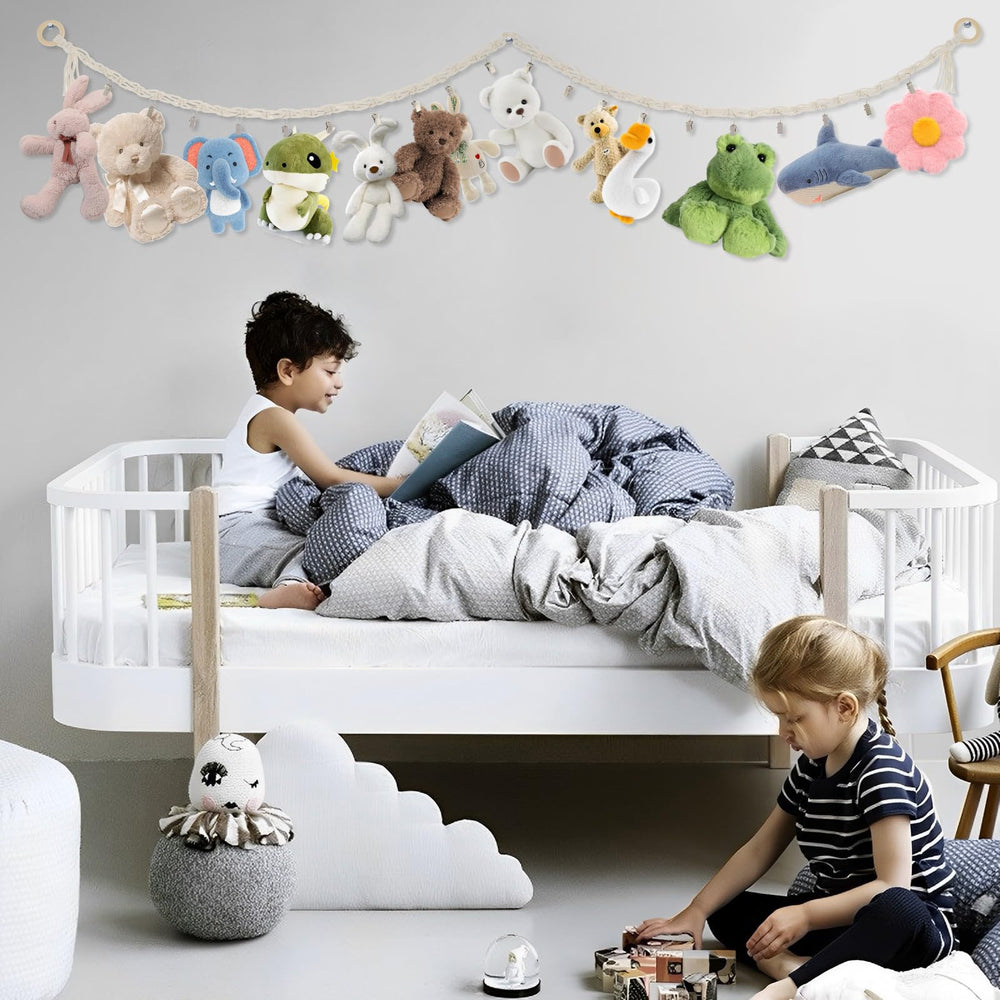 Abizarch Toy Hammock removal clips demonstrate adjustable spacing for varying doll sizes.