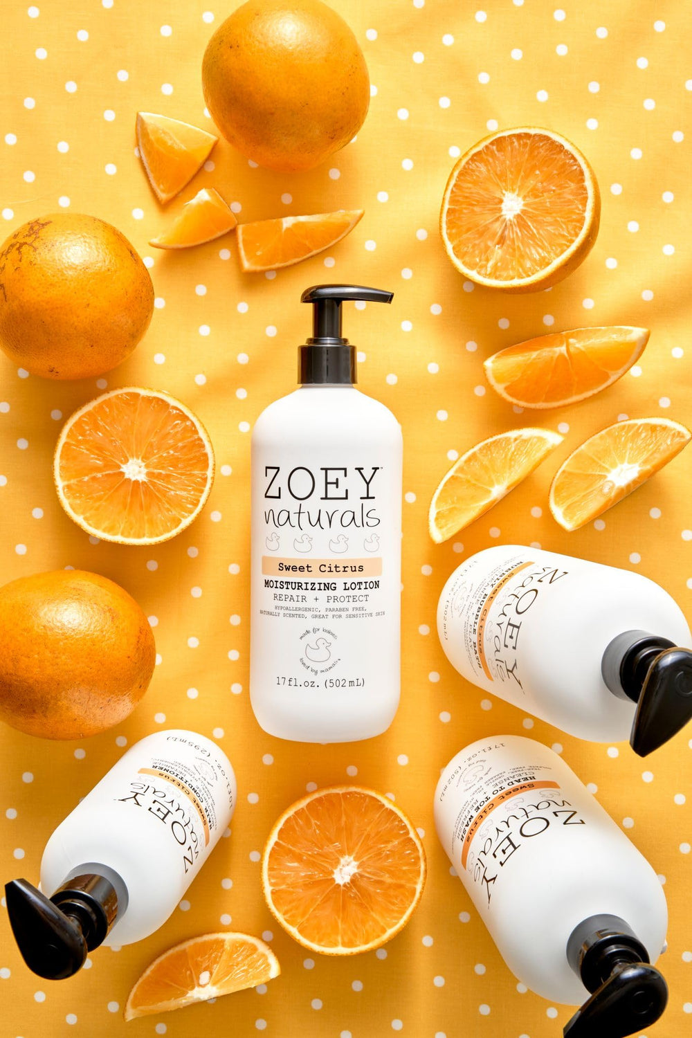 Baby applying Zoey Naturals Sweet Citrus lotion with pump for easy, gentle moisturization