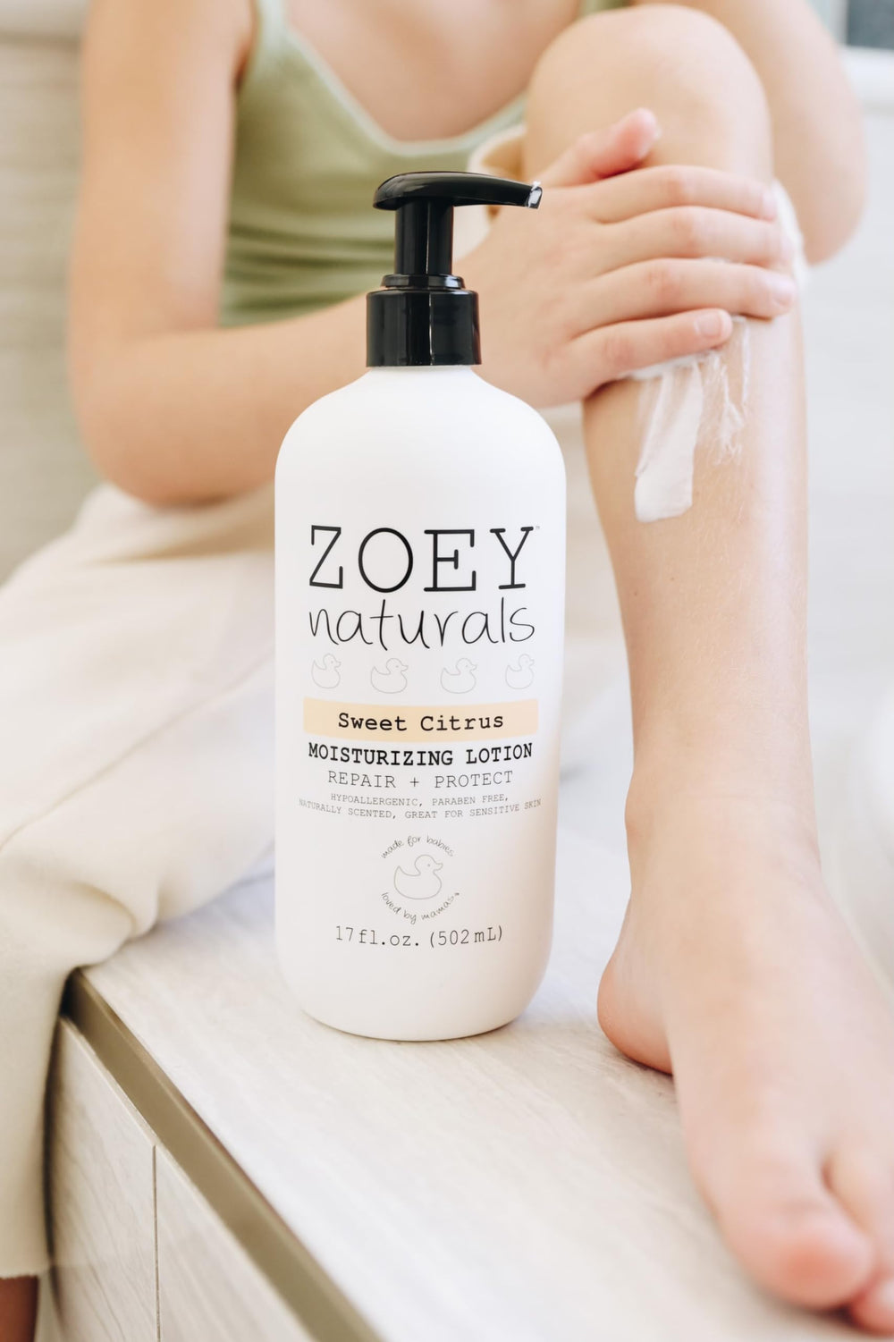 Zoey Naturals Sweet Citrus lotion texture close-up showing creamy hydration for baby skin