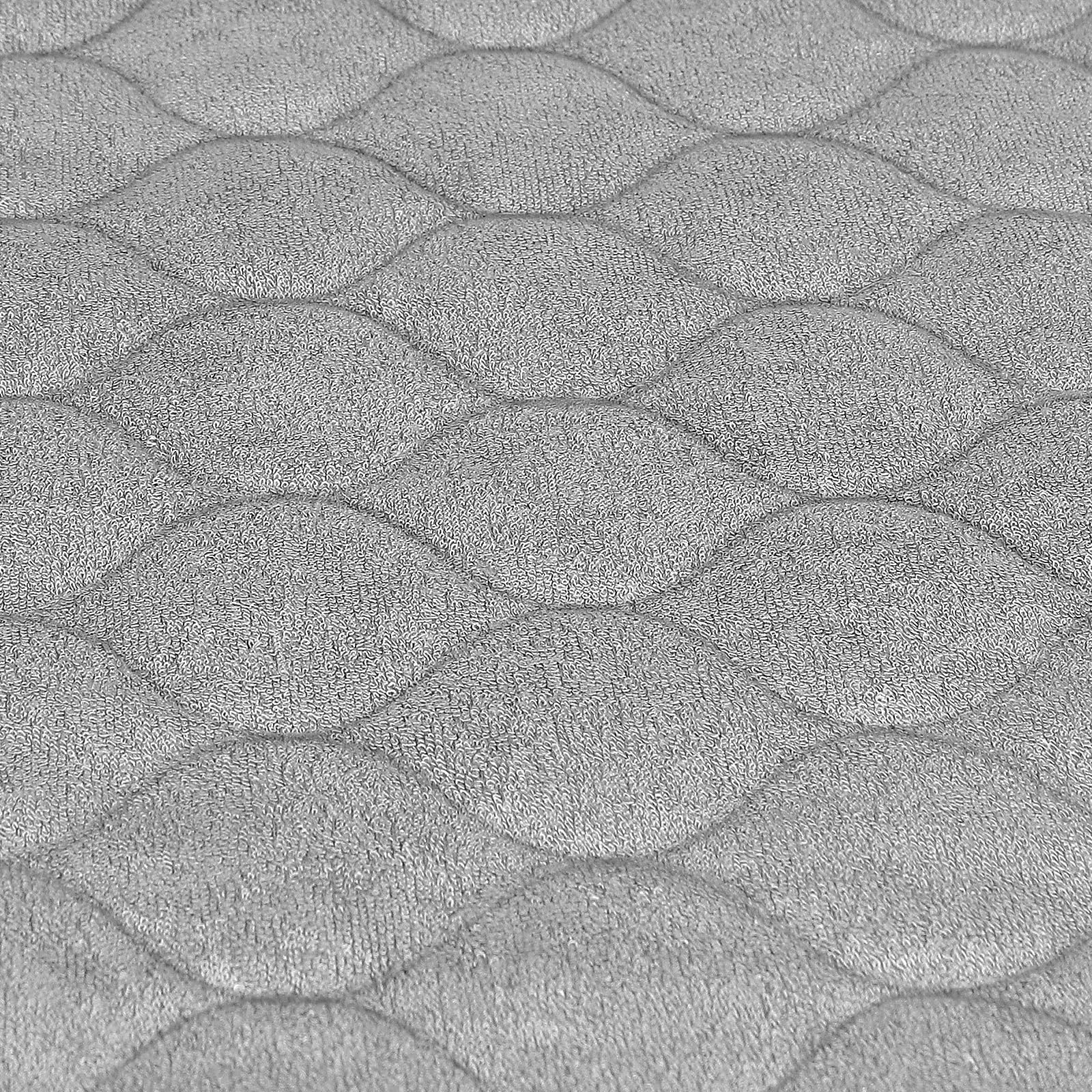 Accmor changing pad liner in use on a table demonstrates a soft, quilted surface for baby comfort.