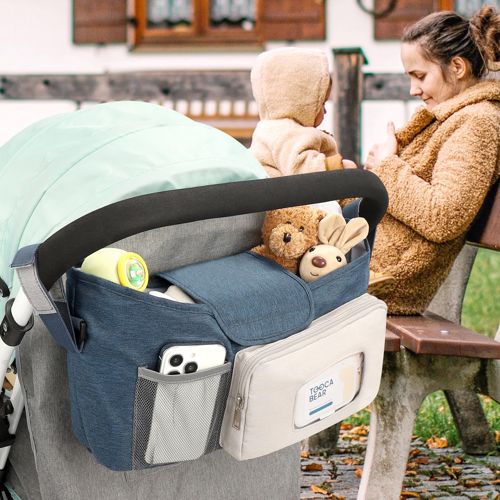 Accmor stroller organizer demonstrates hanging or carrying with strap option