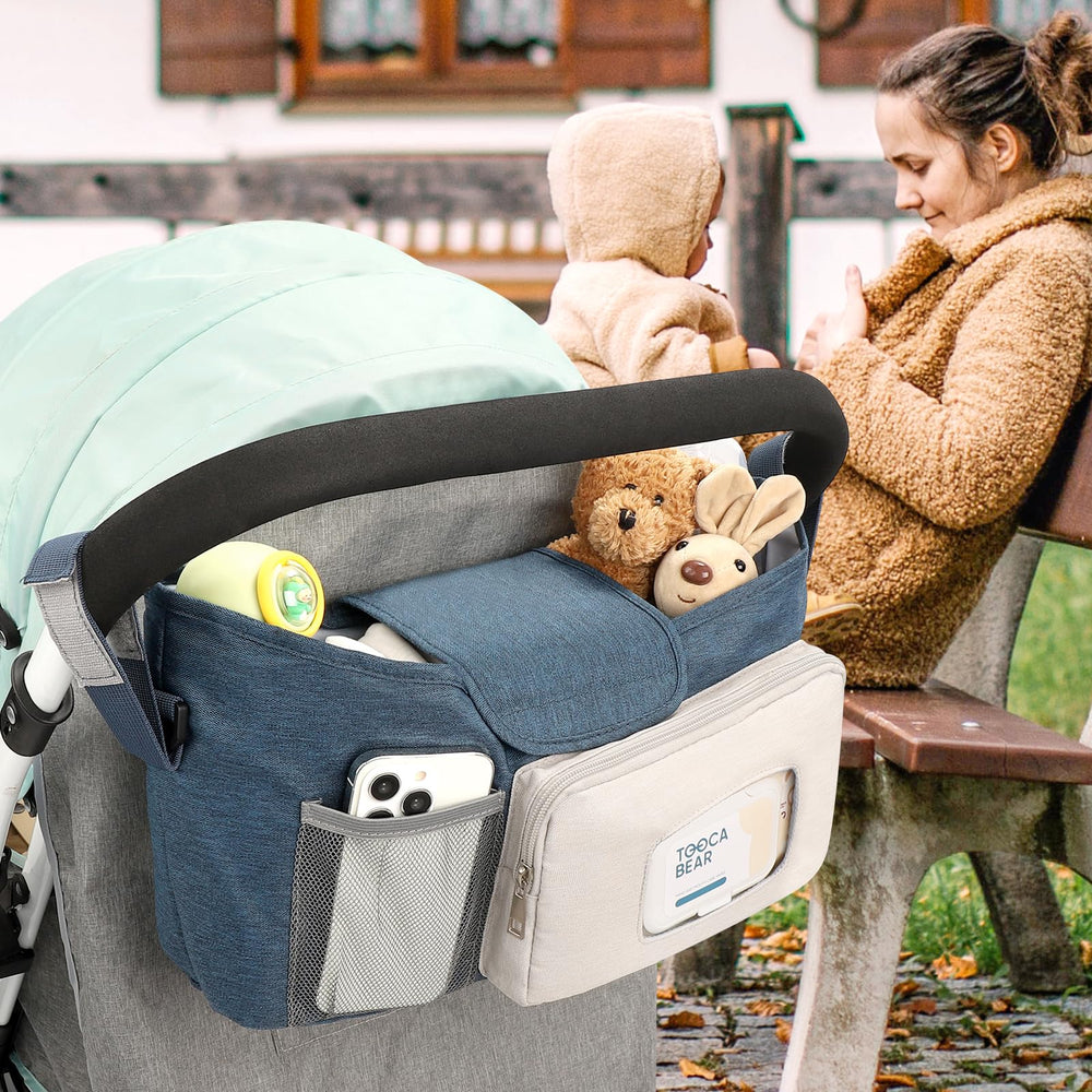 Accmor stroller organizer demonstrates hanging or carrying with strap option