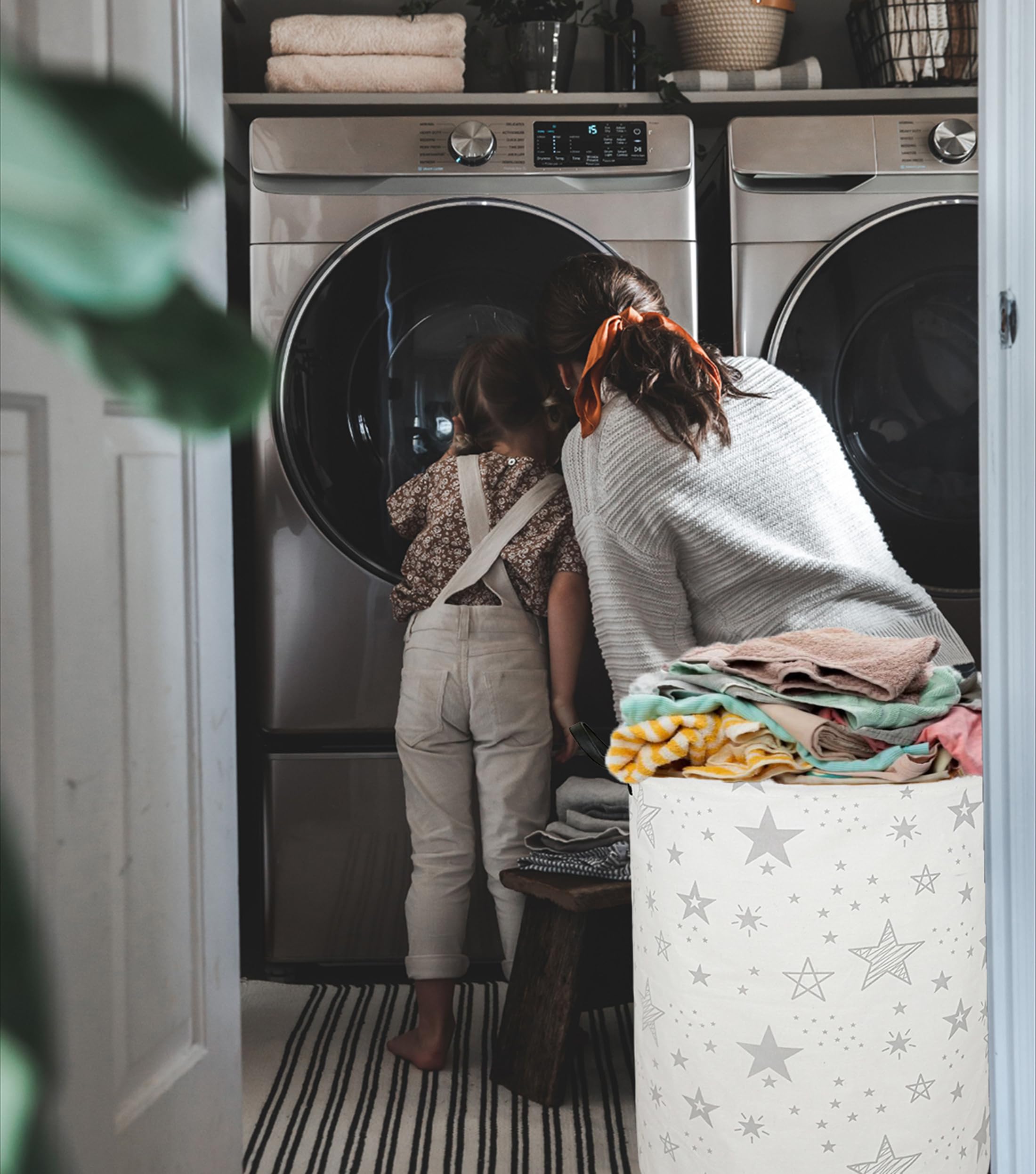 ACMUUNI laundry-hamper grey-star in bedroom demonstrates tidy closet organization.