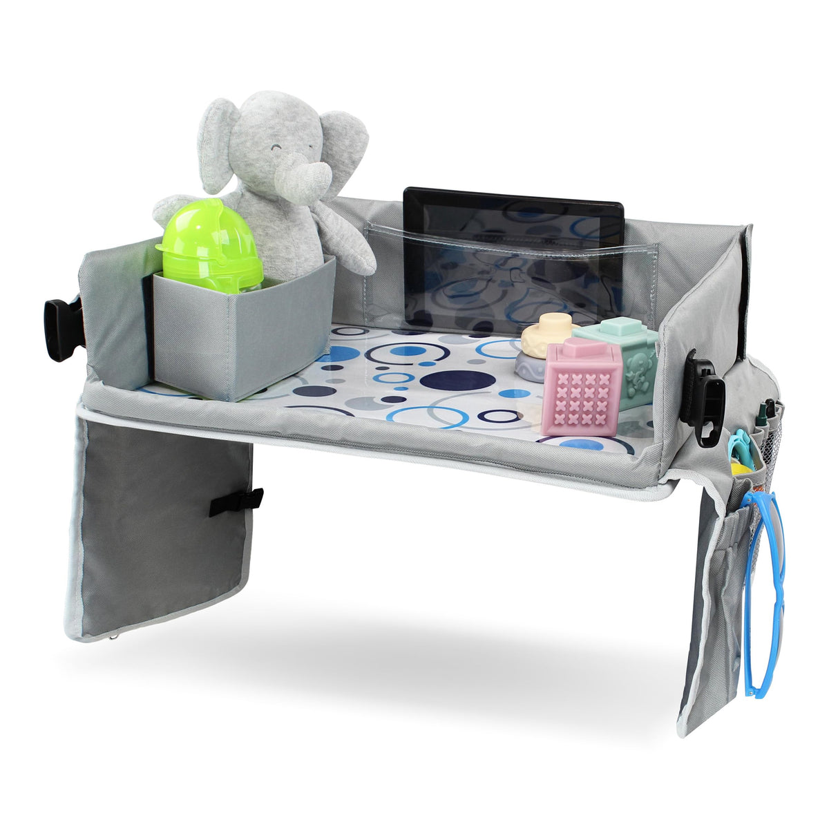 Acorn Baby foldable backseat tray table close-up shows organized storage for toys and snacks.