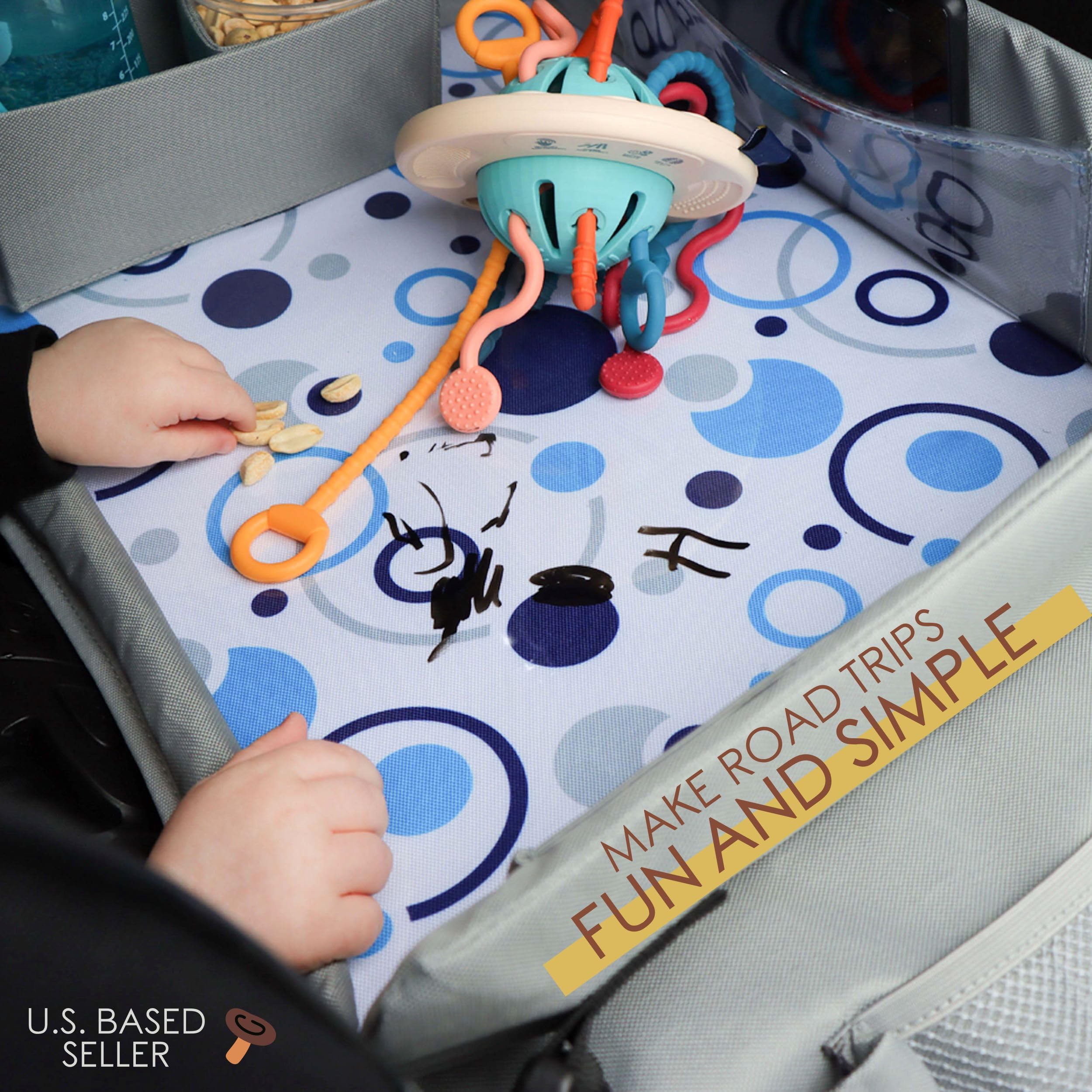 Acorn Baby foldable tray folded for storage shows compact design under seat or in a door.