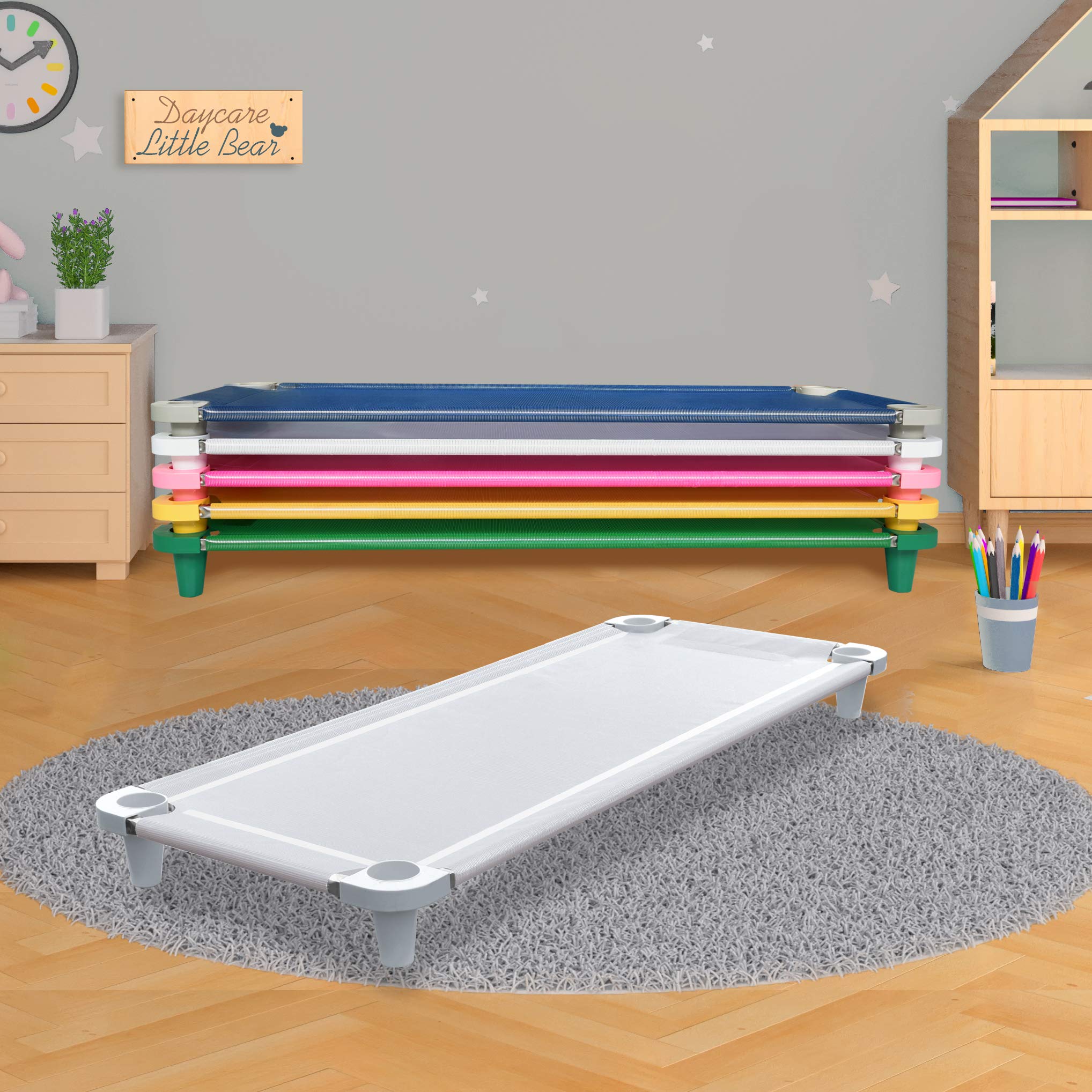 Acrimet nap cot with wide base legs provides stable support.
