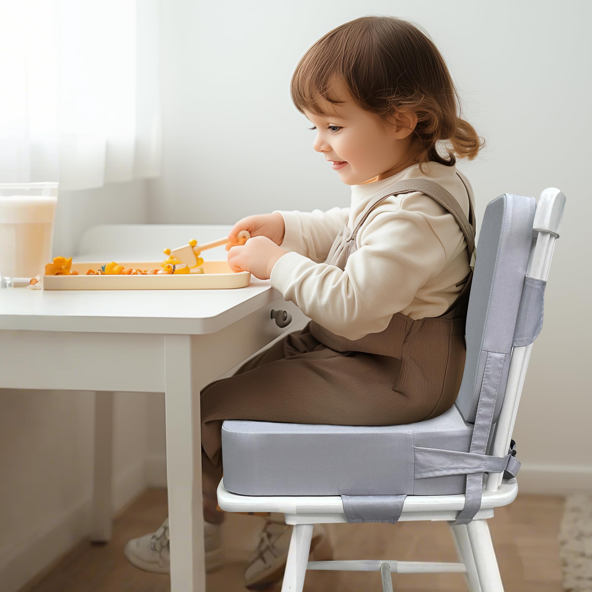 Acxseo booster seat with adjustable straps secures to chair.