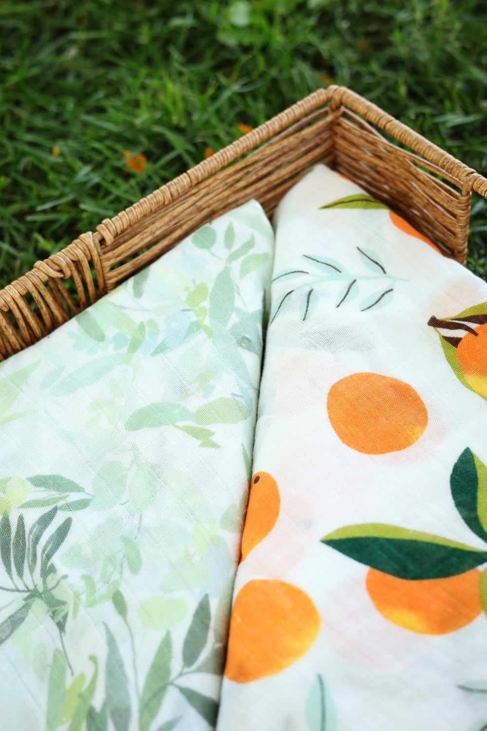 A&D Select Co Citrus Bloom swaddle on baby, easy wrap for calming, quick soothing