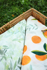 A&D Select Co Citrus Bloom swaddle on baby, easy wrap for calming, quick soothing