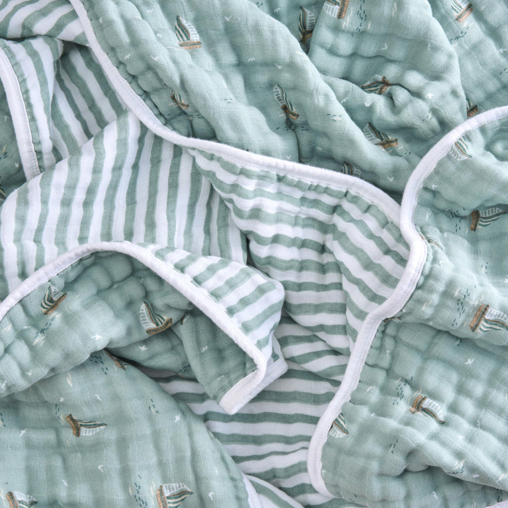 aden + anais Boutique Dream Blanket swaddling setup demonstrates gentle breathable vibes