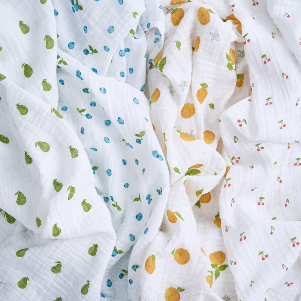 aden + anais Boutique Organic Swaddle Blanket used as nursing cover highlights multi-use convenience.