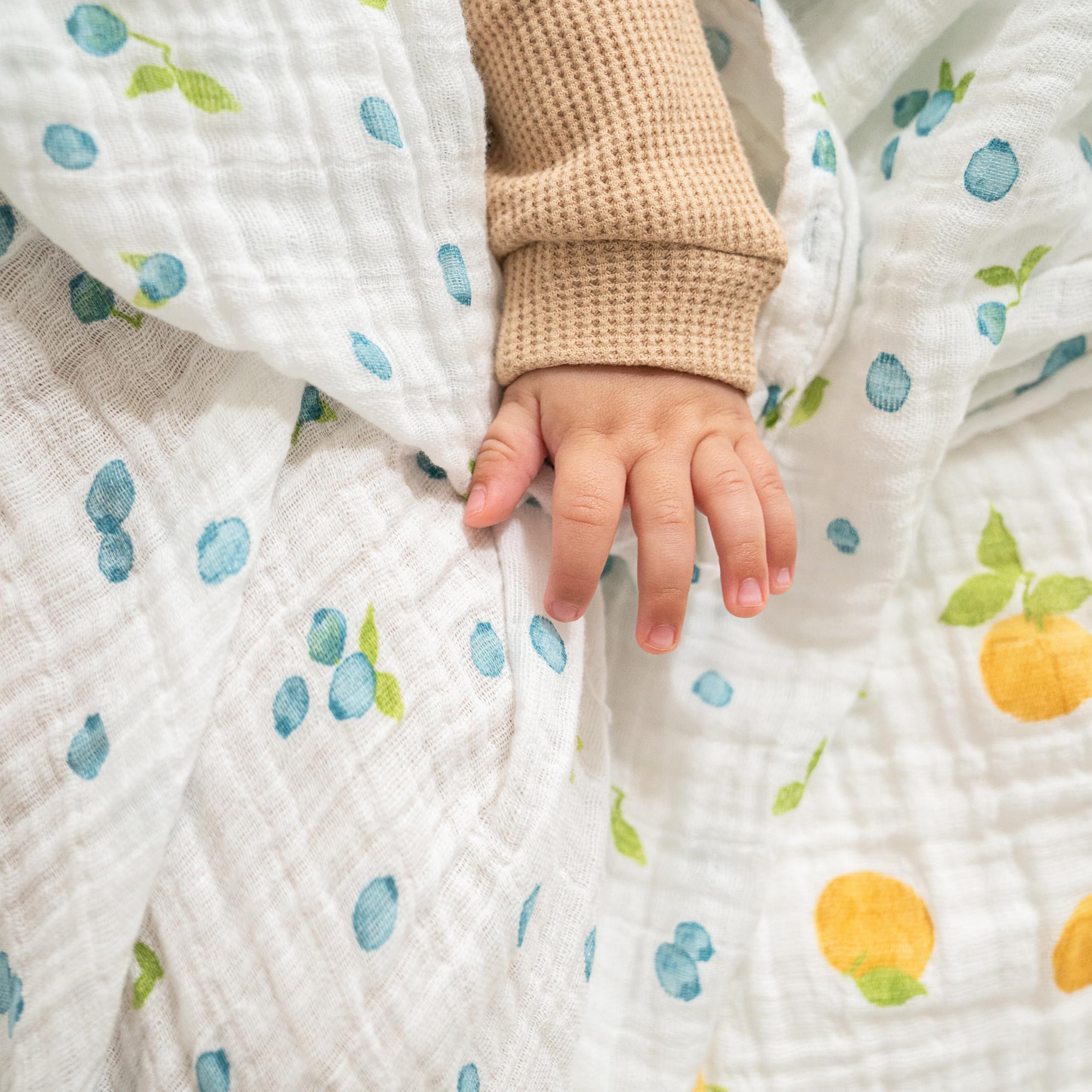 aden + anais Boutique Organic Swaddle Blanket laid on a stroller provides breathable daytime coverage.