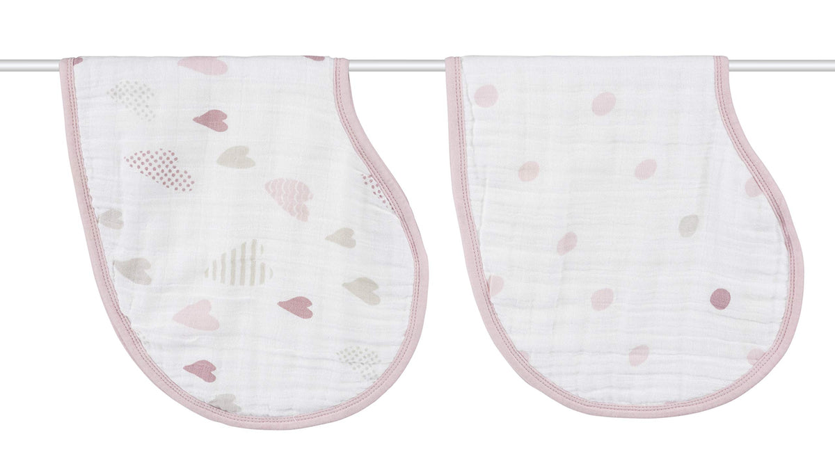 aden + anais Burpy Bib draped over baby shoulder for full-coverage protection.