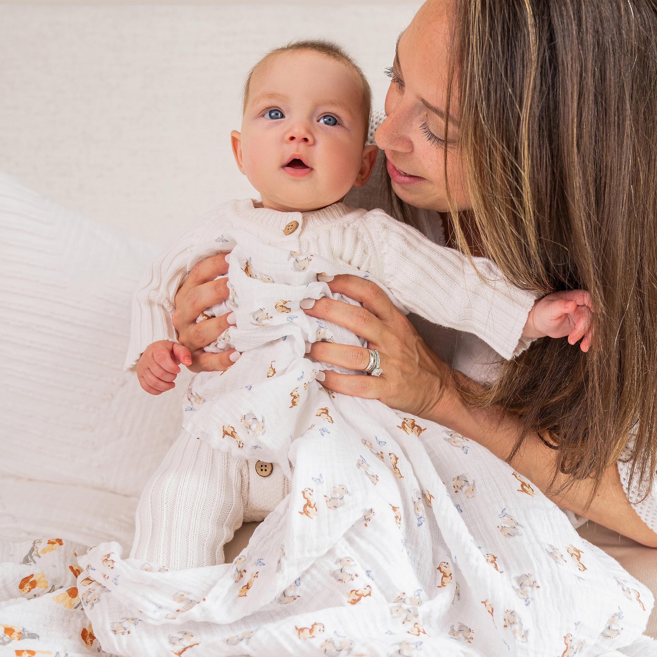 aden + anais Disney muslin swaddle blanket used as a receiving blanket during diaper changes.