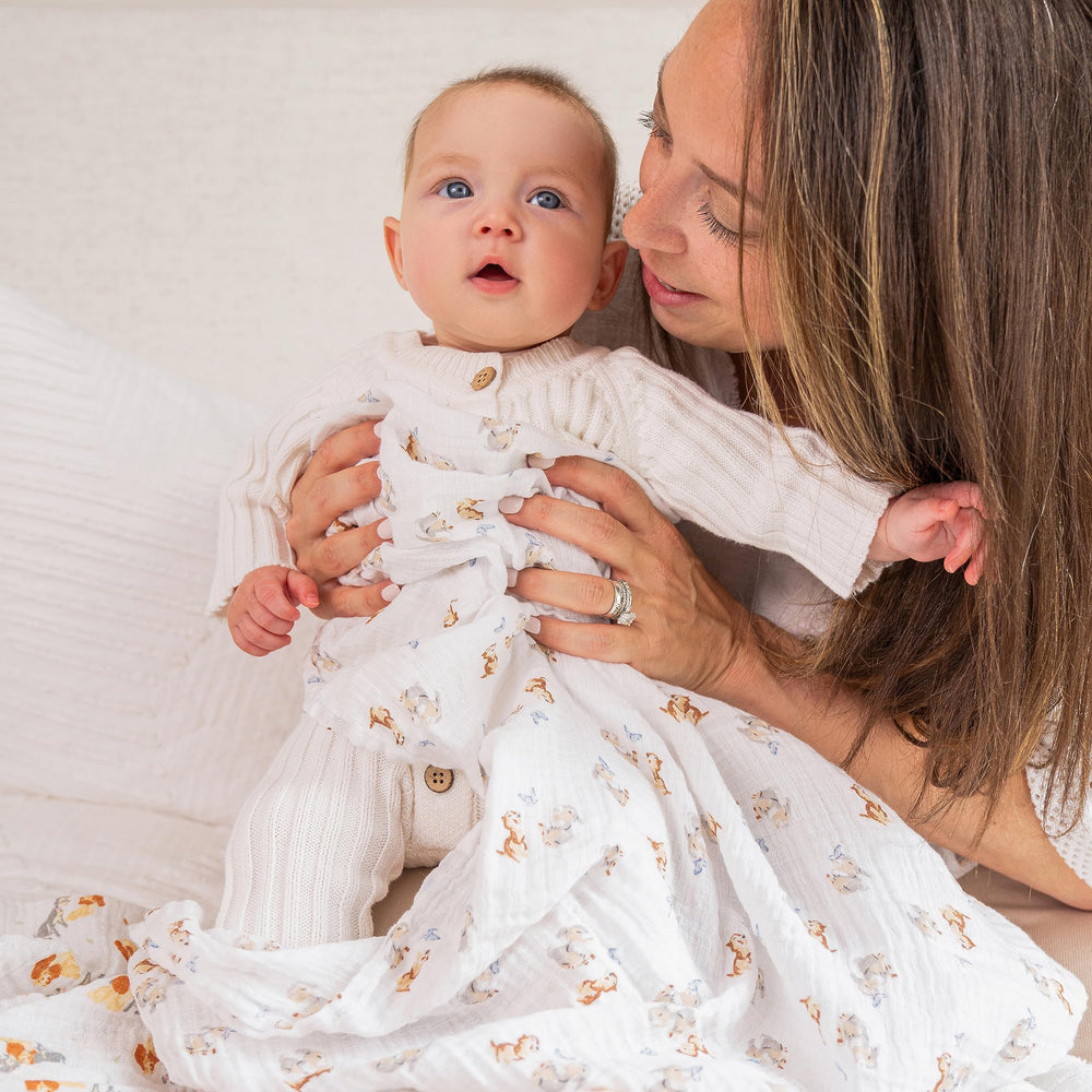 aden + anais Disney muslin swaddle blanket used as a receiving blanket during diaper changes.