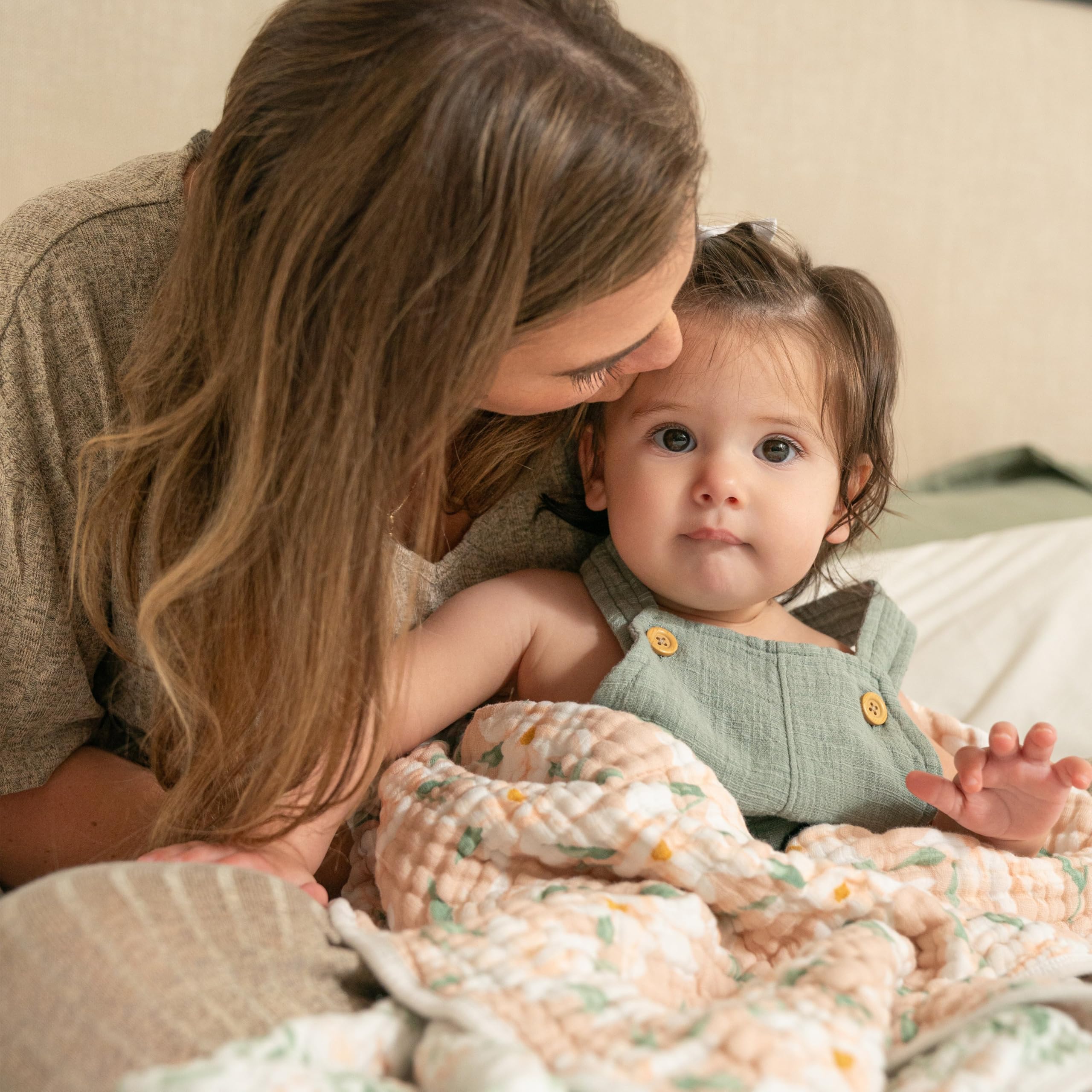 aden + anais Dream Blanket cuddled during playtime for cozy moments.