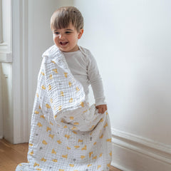 aden + anais Dream Blanket Winnie Pooh baby sleep shot conveys gentle warmth.