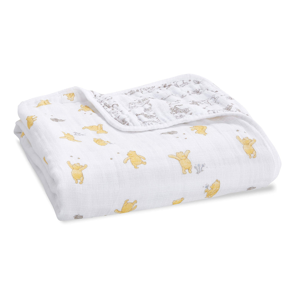 aden + anais Dream Blanket Winnie Pooh hero shot highlights breathable four-layer muslin comfort.