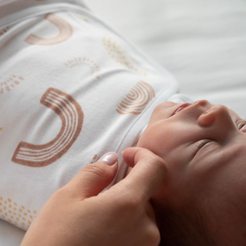 aden + anais tog 1.0 tag closeup confirms breathable warmth.