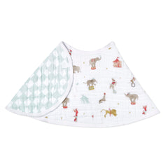 aden + anais Essentials Burpy Bib drapes over shoulders protecting baby outfits from spills