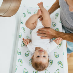 aden + anais avocados changing pad cover in use with elastic edge for snug fit